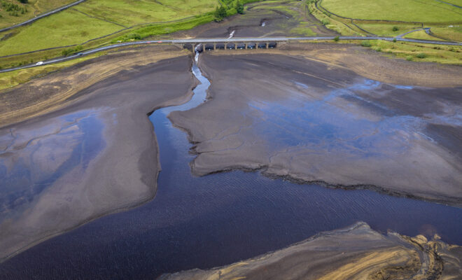 July 3, 2023: An aerial view of low water levels at Woodhead Reservoir in Glossop, England, after the United Kingdom sweltered through its hottest June on record. 2023 was the world’s warmest year on record, beating the next warmest year (2016) by a record-setting margin of 0.23 of a degree F (0.13 of a degree C). (Image credit: Christopher Furlong/Getty Images)