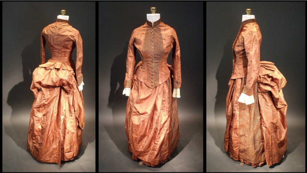 Three views of the 1880s silk bustle dress in which crumpled bits of paper containing a code were found. The pocket where the code was found is located under the overskirt at the right hip. (Image credit: Sara Rivers Cofield)