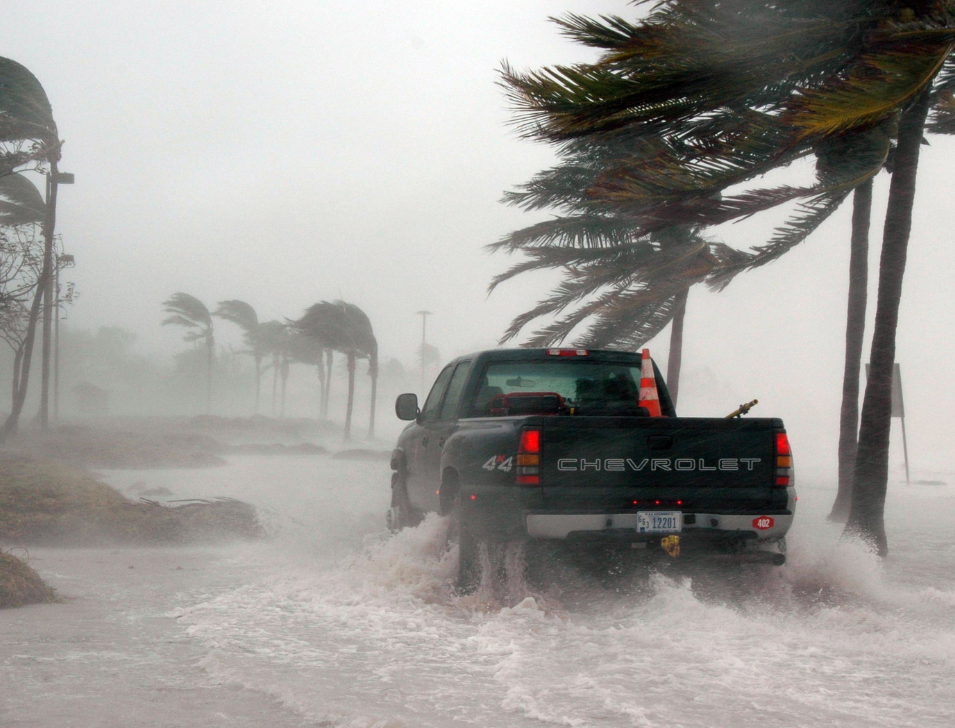 Truck in coastal flooding and storm. Image by Canva.