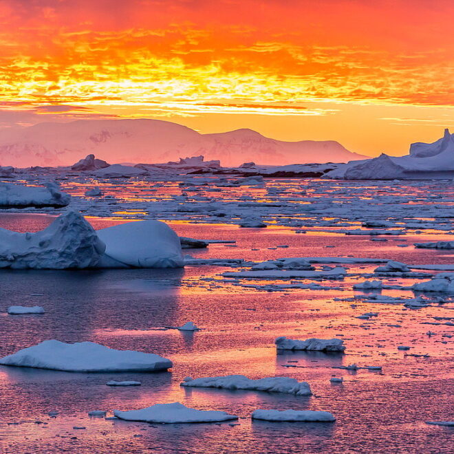71319675-Sunset-over-ice-floes-and-icebergs-near-Pleneau-Island-Antarctica-Southern-Ocean-Polar-Regions