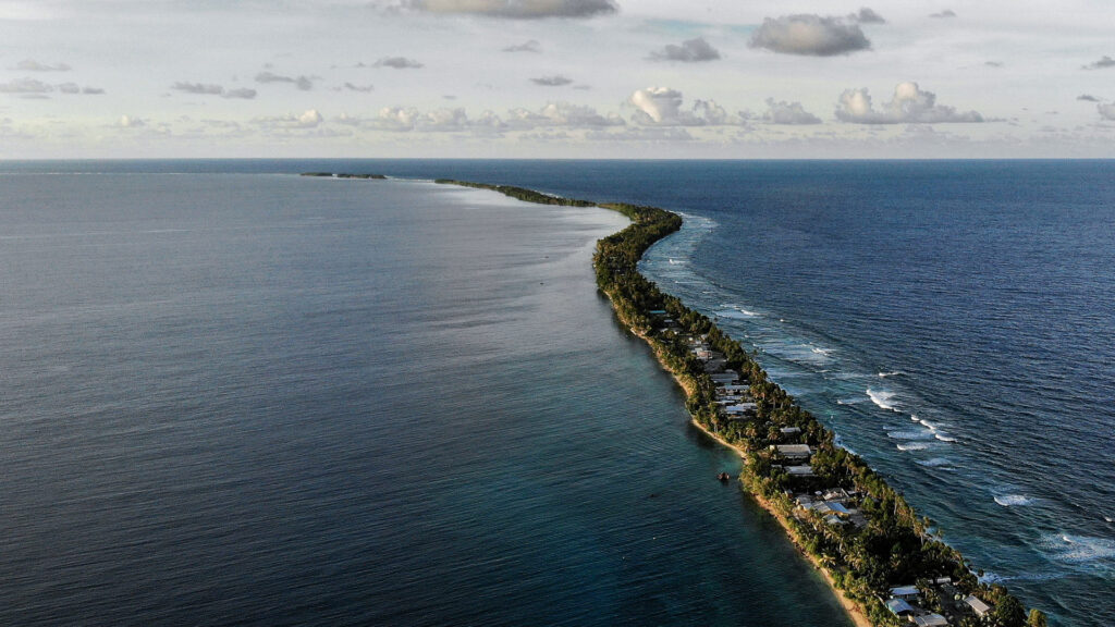 The land between lagoon and beach in Funafuti, Tuvalu. The highest point on Tuvalu is 4.6 metres above sea level. With five millimetres per year of regional sea level rise (above the global average), the small nation could be inundated within a century. Credit: Mario Tama / Getty Images