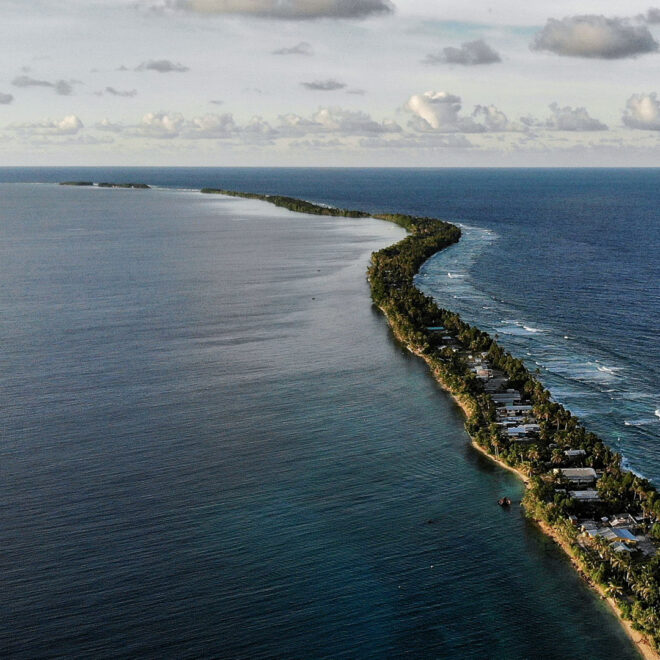 The land between lagoon and beach in Funafuti, Tuvalu. The highest point on Tuvalu is 4.6 metres above sea level. With five millimetres per year of regional sea level rise (above the global average), the small nation could be inundated within a century. Credit: Mario Tama / Getty Images