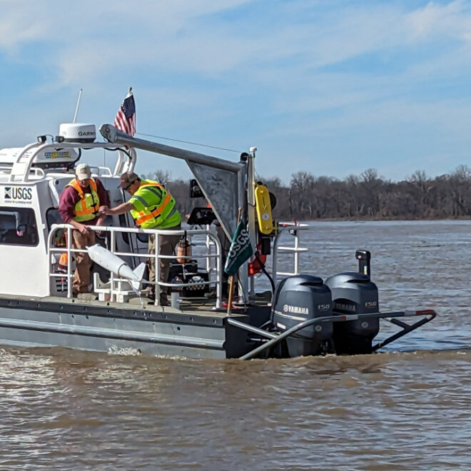 A photo of USGS vessel "Hypoxia Bandit" on the Mississippi River in Vicksburg in early 2024. USGS scientists are using a US-D-96 sampler to collect sediment and water-quality samples from the river. (Image credit: USGS Lower Mississippi Gulf Water Science Center)