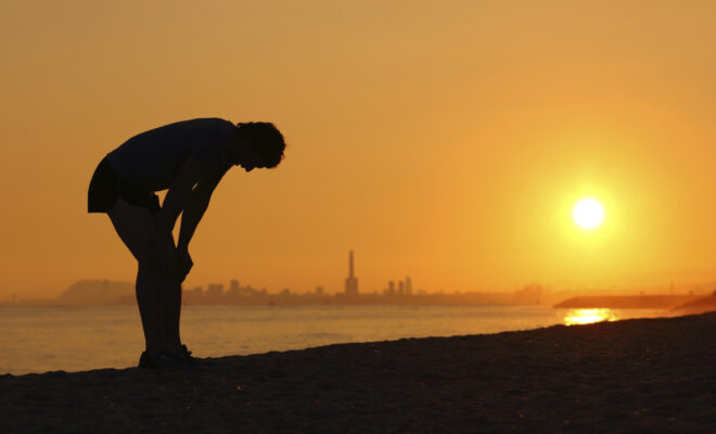 Silhouette of a person at sunset during a heatwave. (Image credit: iStock)