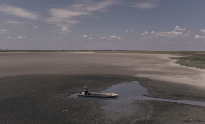 MELENCI, SERBIA - JULY 25, 2024: A worker from a spa collects mud at Lake Rusanda, which dried up for the first time in recorded history during a prolonged heatwave. Europe had its warmest July, and warmest year-to-date, on record. (Image credit: Getty Images)