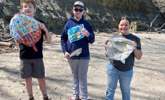 Local Sea Scouts picking up debris from a public beach in Bay Village, Ohio.