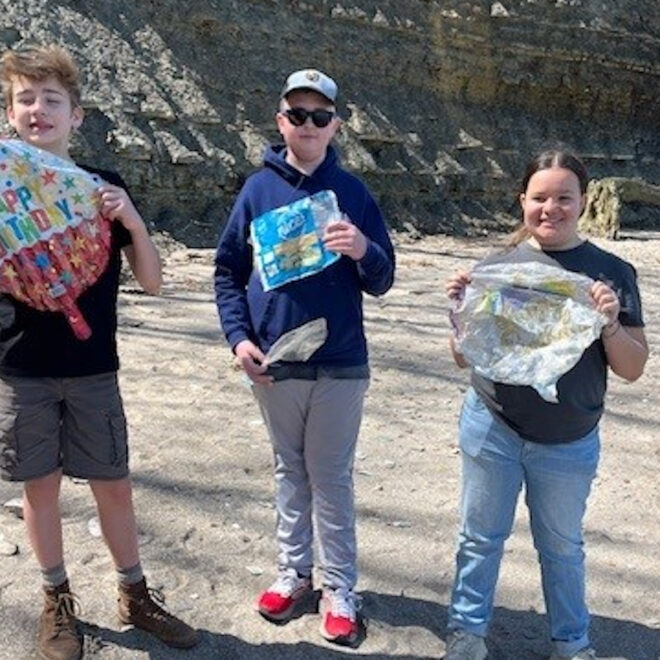 Local Sea Scouts picking up debris from a public beach in Bay Village, Ohio.
