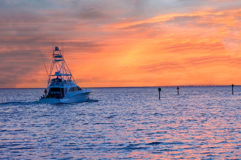 Sport Fishing Boat leaving the harbor at sunrise, Florida