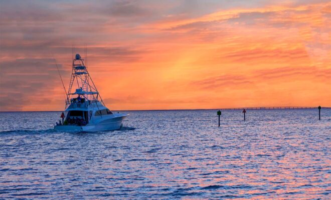 Sport Fishing Boat leaving the harbor at sunrise, Florida