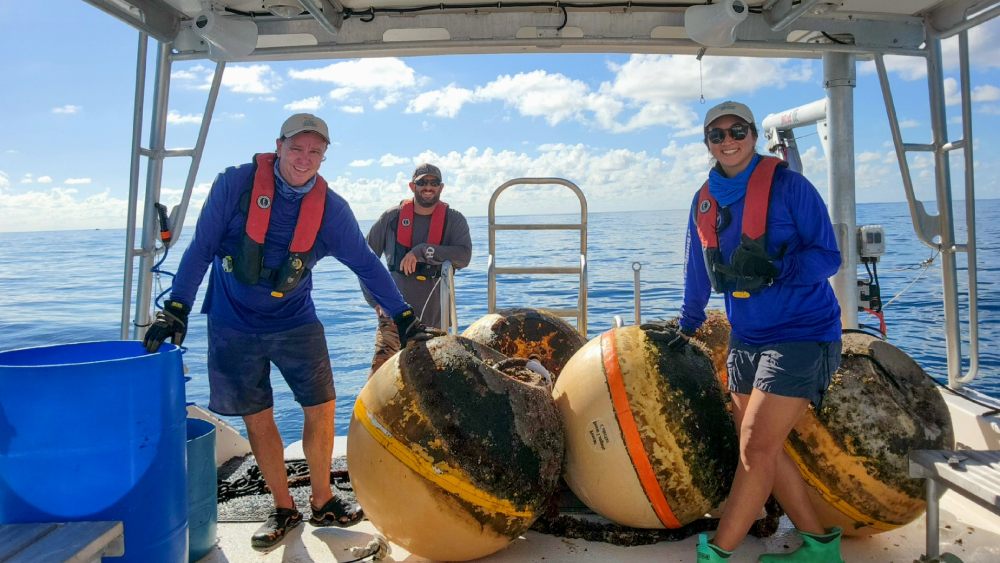 The NOAA Florida Keys National Marine Sanctuary Buoy Team performs maintenance on boundary buoys for Carysfort Reef Sanctuary Preservation Area. Photo: Brittany Torres/NOAA