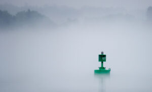 Navigation Aid, buoy, in the fog. Photo by Andrew Marek/Shutterstock