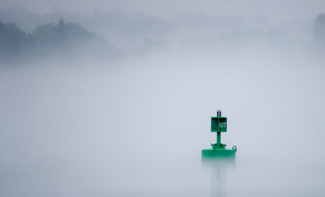 Navigation Aid, buoy, in the fog. Photo by Andrew Marek/Shutterstock