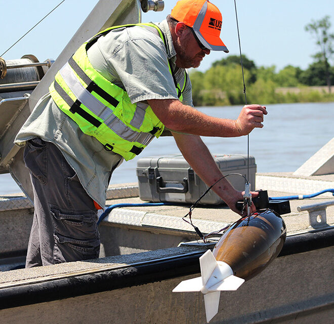 Lane Simmons of the U.S. Geological Survey collects a water-quality sample at the Mississippi River at Baton Rouge, Louisiana (USGS 07374000). Credit: Scott Dennis, USGS.