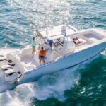 Powercat fishing boat running in blue water