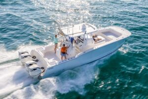 Powercat fishing boat running in blue water