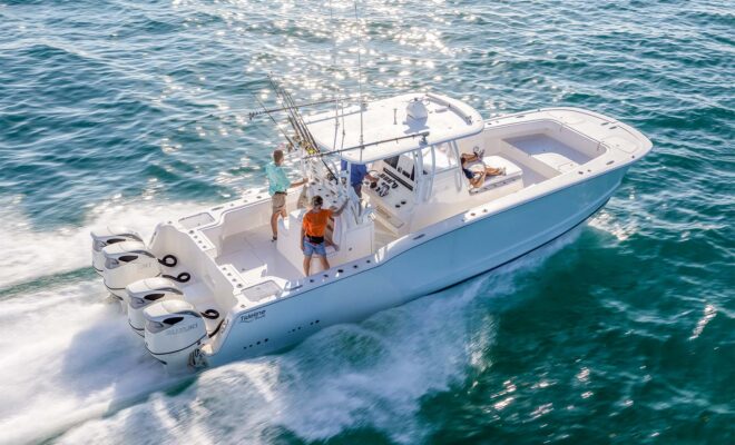 Powercat fishing boat running in blue water