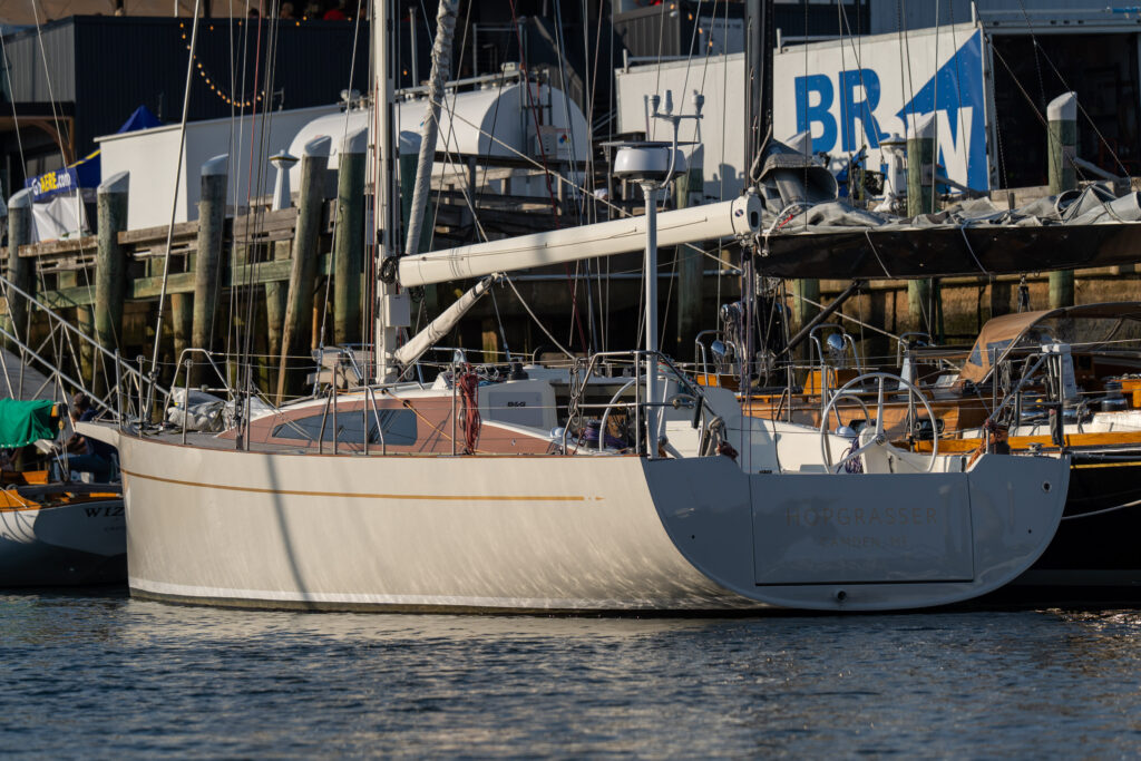 A gray hull boat sits at the dock