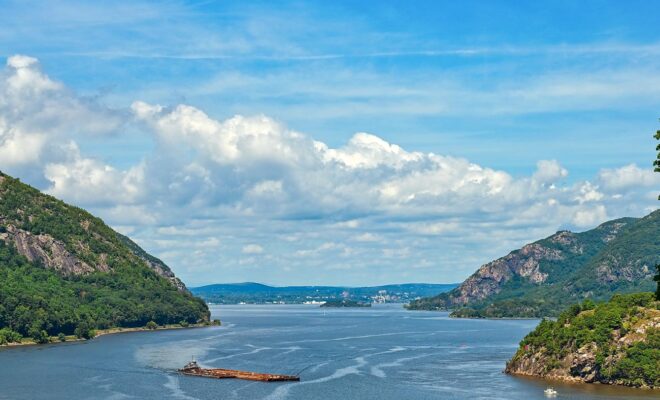 A barge moves down the Hudson River at West Point, New York