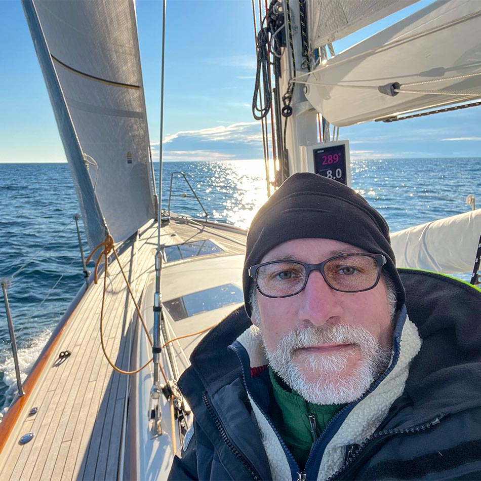 Capt Josh Moore aboard a sailboat