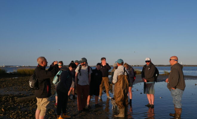 Sea Grant Aquaculture Leadership Academy participants tour a Sandbar Oyster Company oyster and salt marsh restoration project North Carolina. (Photo by LaDon Swann)