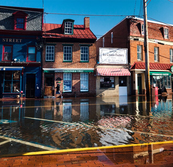 High-tide flooding on October 24, 2017, submerged roads and parking areas along Dock Street, in the historic heart of Annapolis, Maryland. Photo by Will Parson, Chesapeake Bay Program. Used with permission.