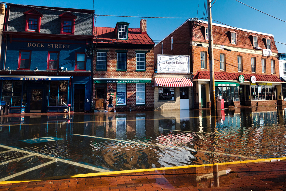 High-tide flooding on October 24, 2017, submerged roads and parking areas along Dock Street, in the historic heart of Annapolis, Maryland. Photo by Will Parson, Chesapeake Bay Program. Used with permission.
