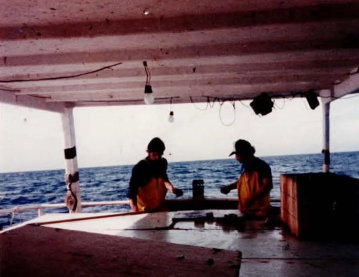 Fishermen work on the open deck of Miss Gail off Cortez, Florida, circa 1980. Credit: Glenhart Brooks.