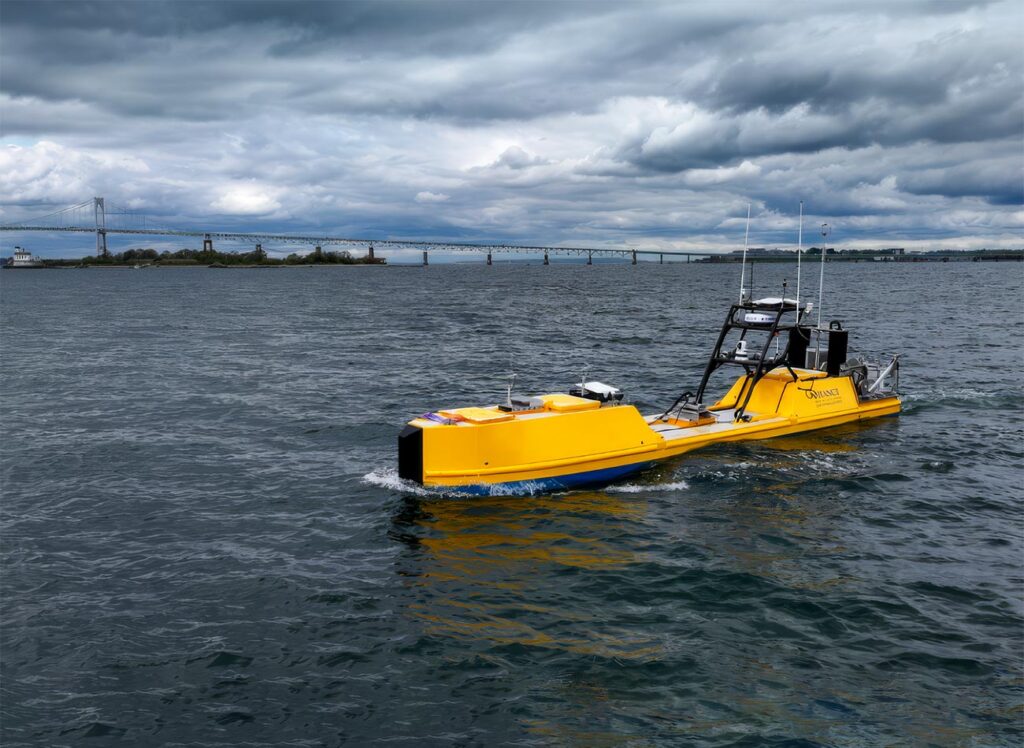 NOAA Autonomous Surface Vehicle in Narragansett Bay during testing. Goat Island and the Newport Bridge in the background.