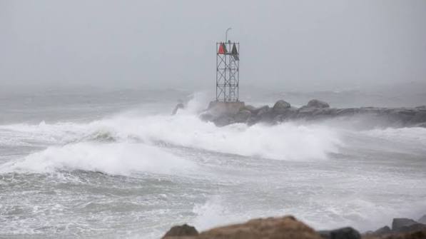 Large waves crash over a jetty as a large coastal storm bears down on the region on March 2, 2018 in Scituate, Massachusetts. A powerful nor'easter is bringing snow, rain and high wind to much of the U.S. Northeast. (Image credit: Scott Eisen/Getty Images)